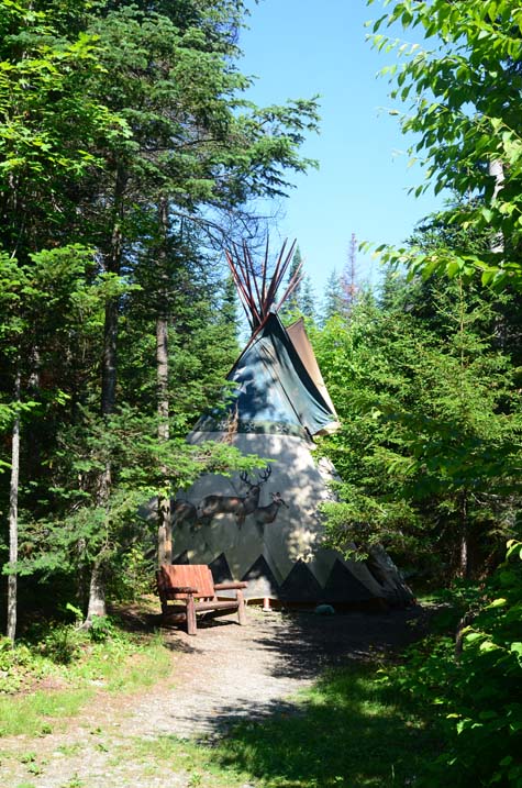 The tipi nestled in the trees